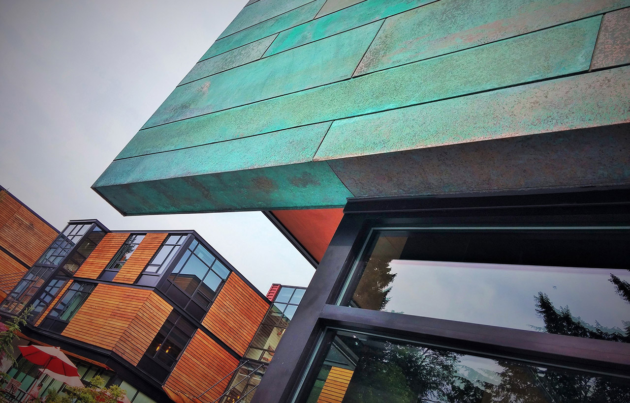 Exterior copper detail of Eagle Harbor Market Building, designed by a west coast commercial architect firm specializing ins sustainable buildings