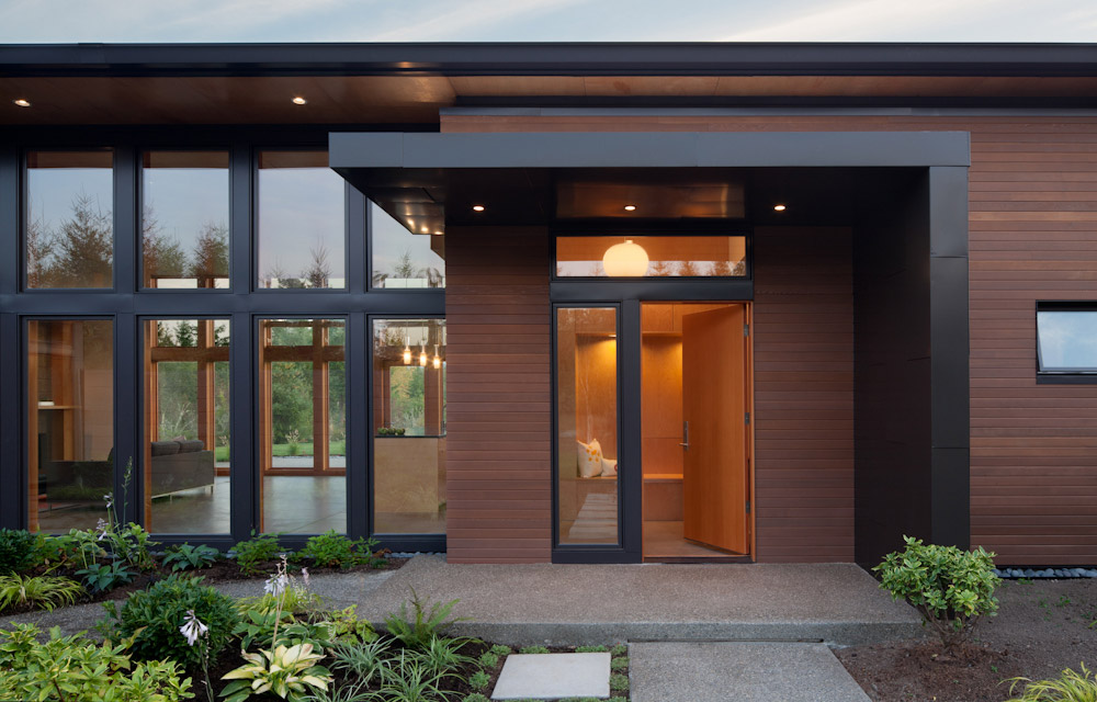 Exterior entry view at Olympia Prairie Home, designed by a sustainable home architect firm specializing in eco-friendly homes
