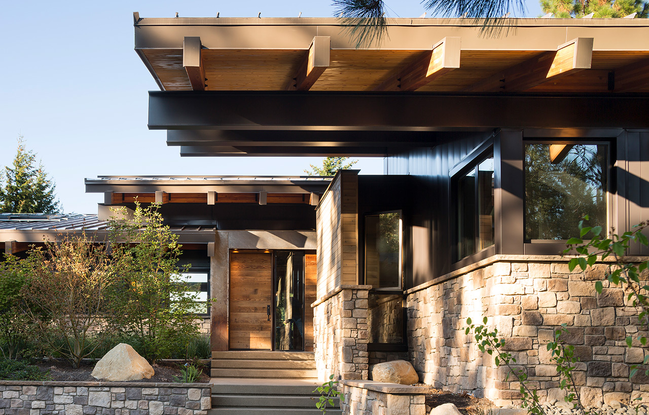 View of exterior and front door of Suncadia Resort net zero home by Seattle sustainable architecture company