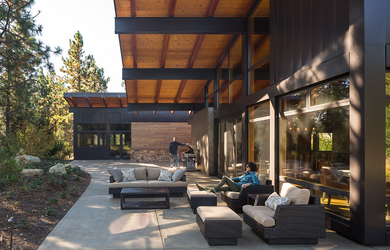 Side view of covered patio of Suncadia Resort net zero home by Seattle sustainable architecture firm