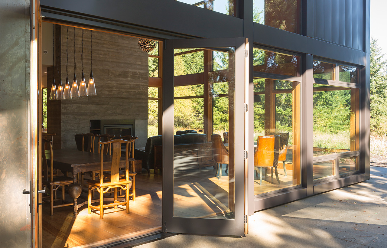View into dining room from exterior of Suncadia Resort net zero home by Seattle sustainable architecture firm